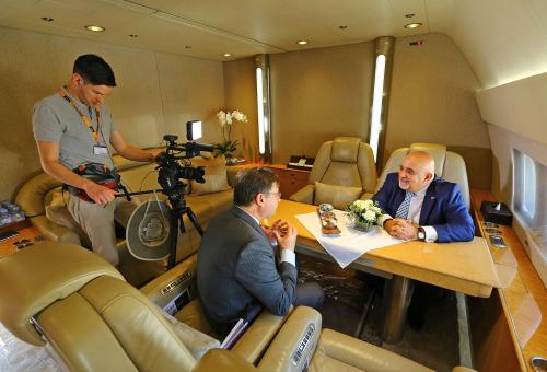 Video producer Ian Whelan (left) with AIN editor-in-chief Charles Alcock and Comlux CEO Richard Gaona.